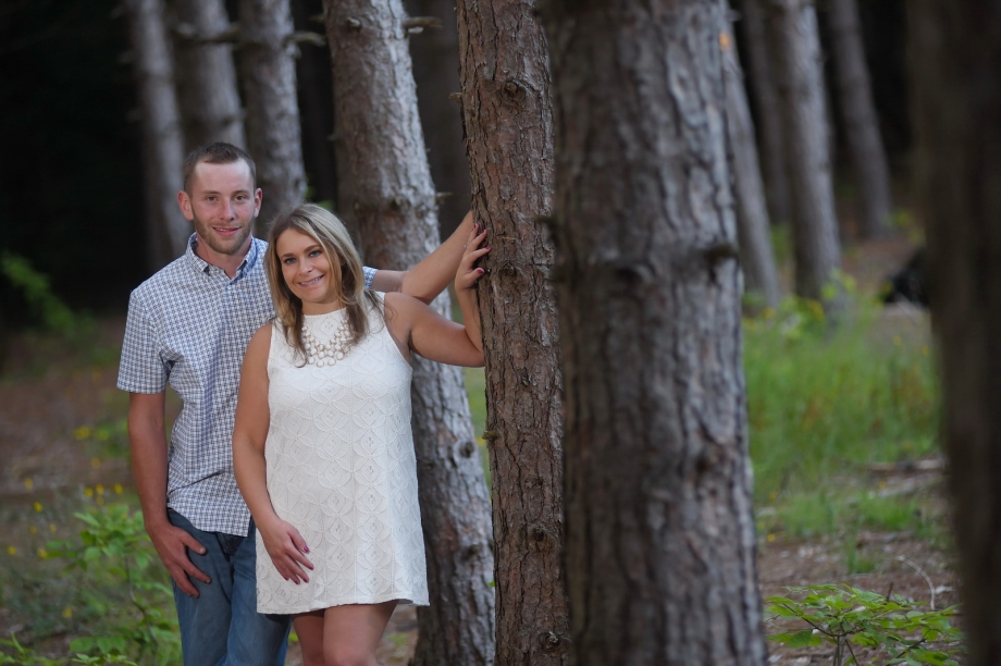 Couple looking around Tree