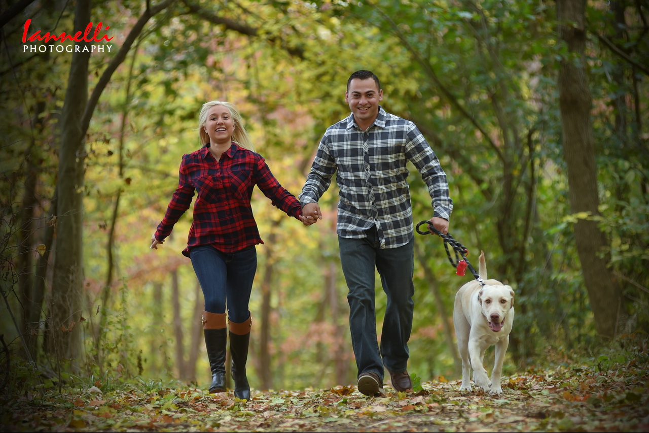 Couple Running with Dog
