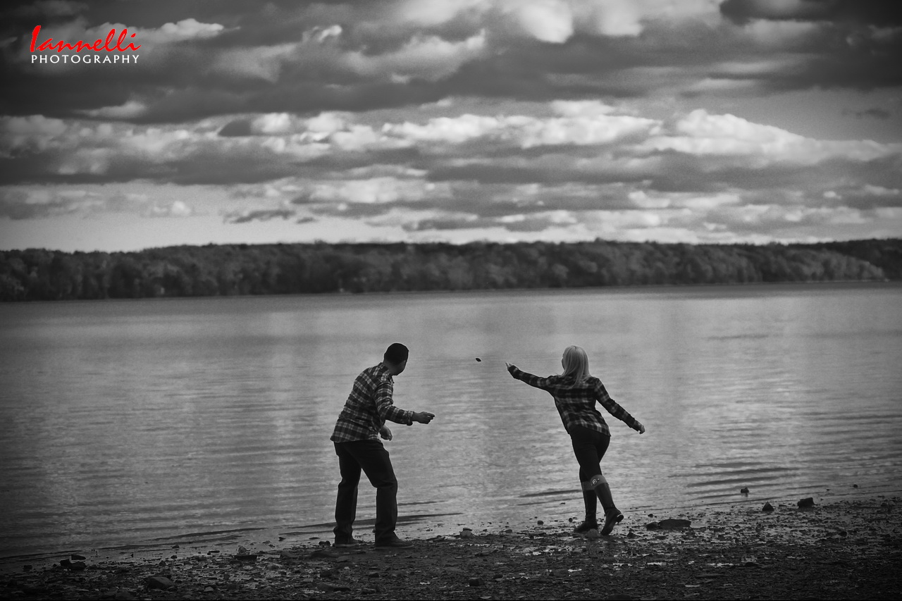 Couple skipping stones in Hudson River