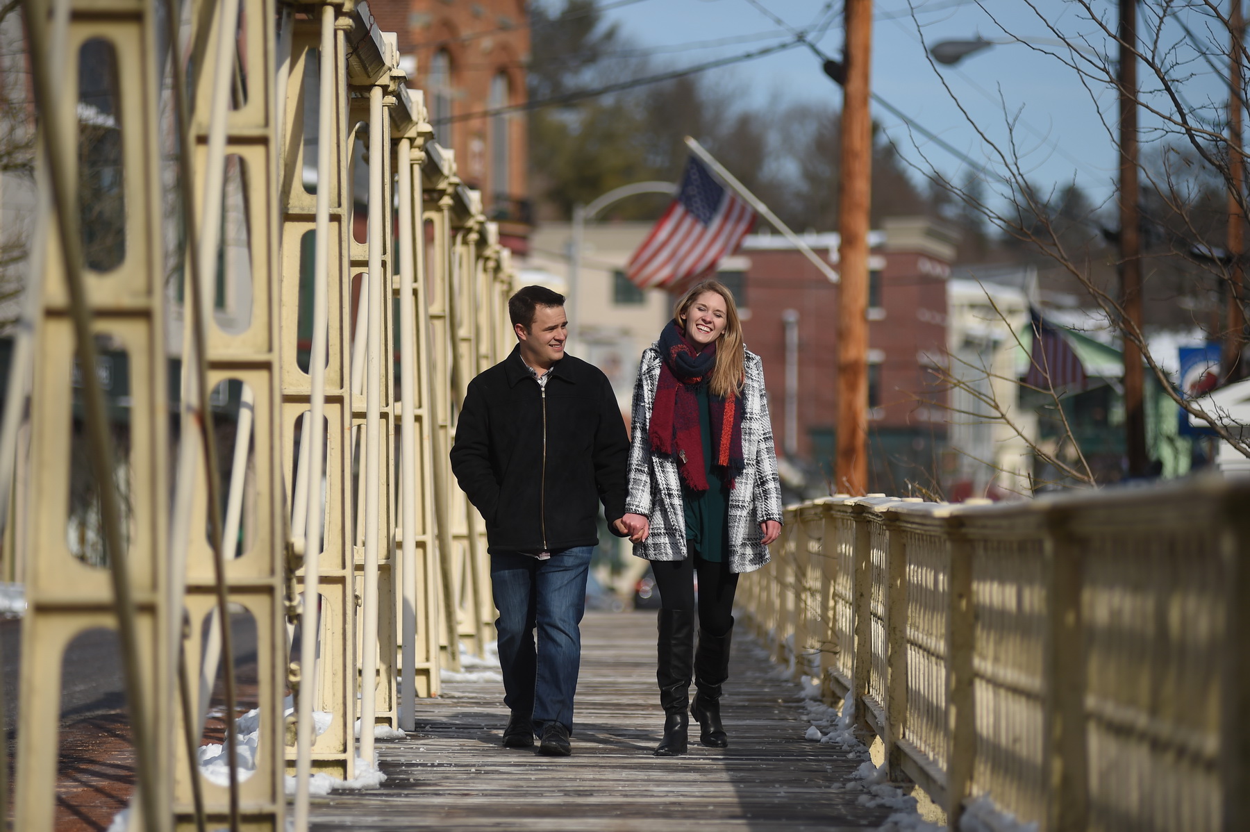 Couple Walking Across Bridge
