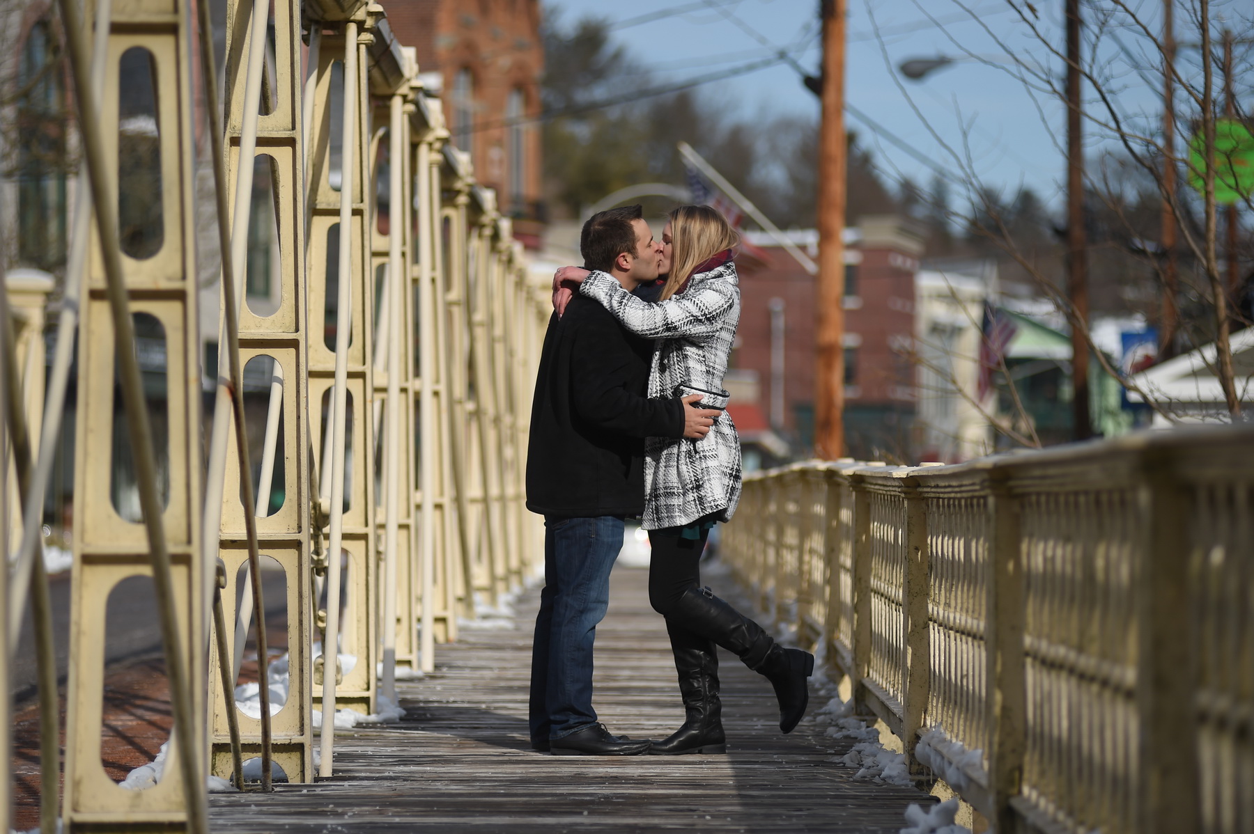 Couple Kissing on Bridge