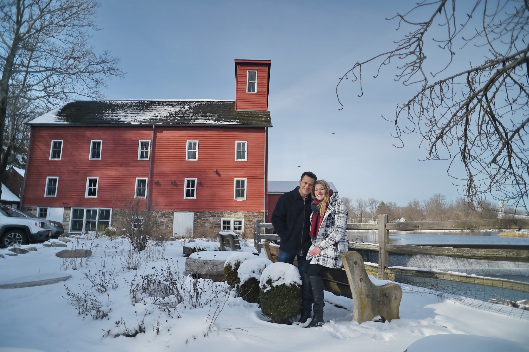 Couple seated near Red Barn